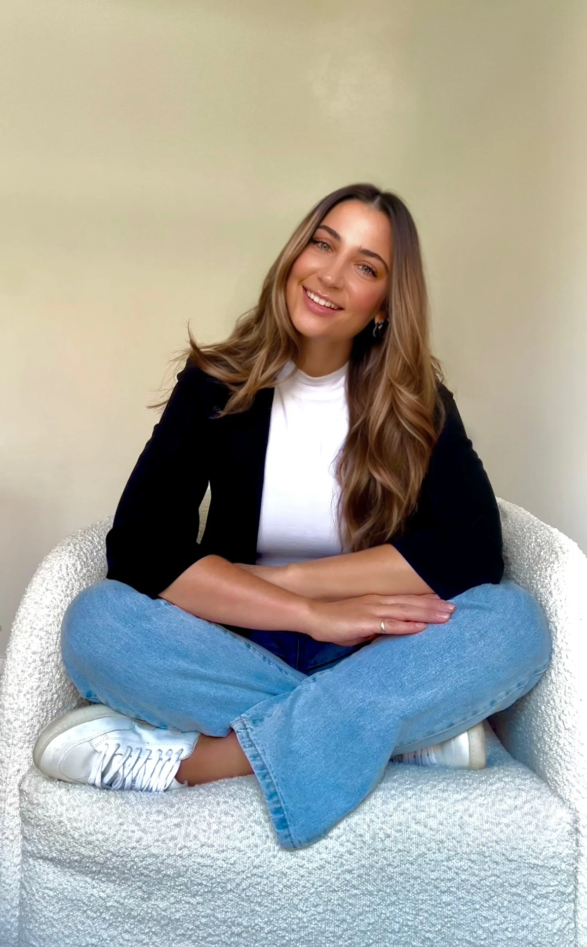 Monique Girardo psychologist sitting and smiling at camera