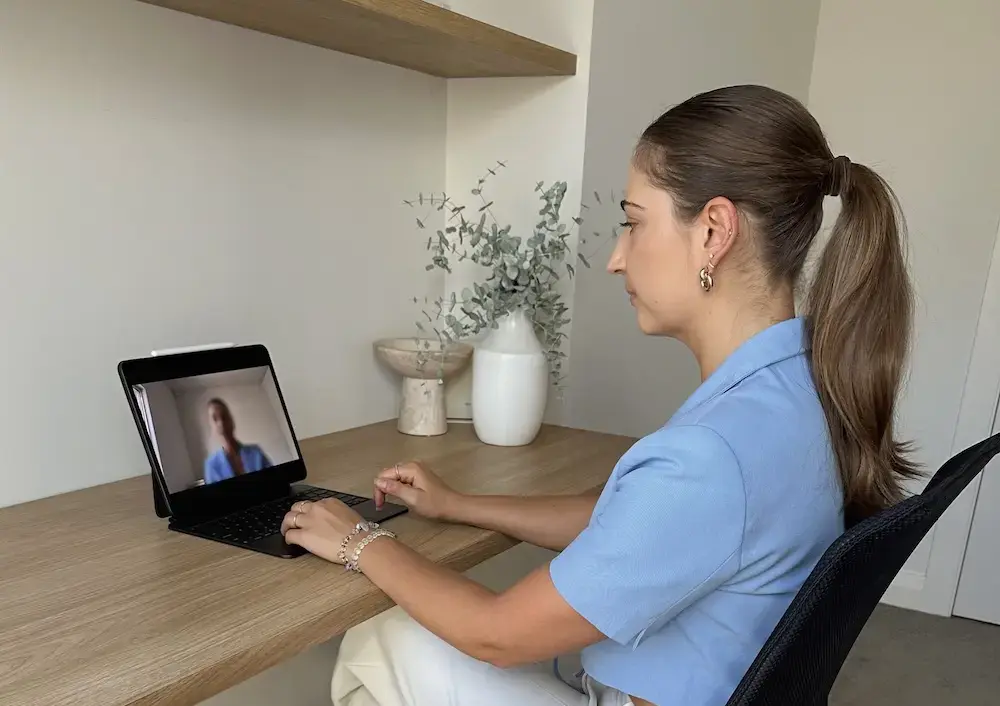 Monique Girardo working with a client in a meeting